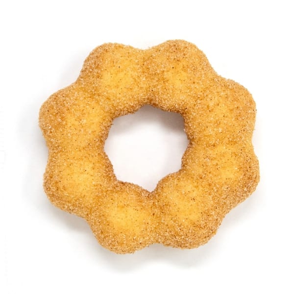 A golden-brown Daddy Donut mochi donut, shaped like a flower, coated in cinnamon sugar.
