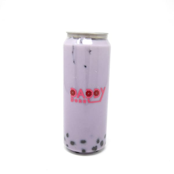 A Daddy Donut canned taro bubble tea with black boba pearls against a white background.