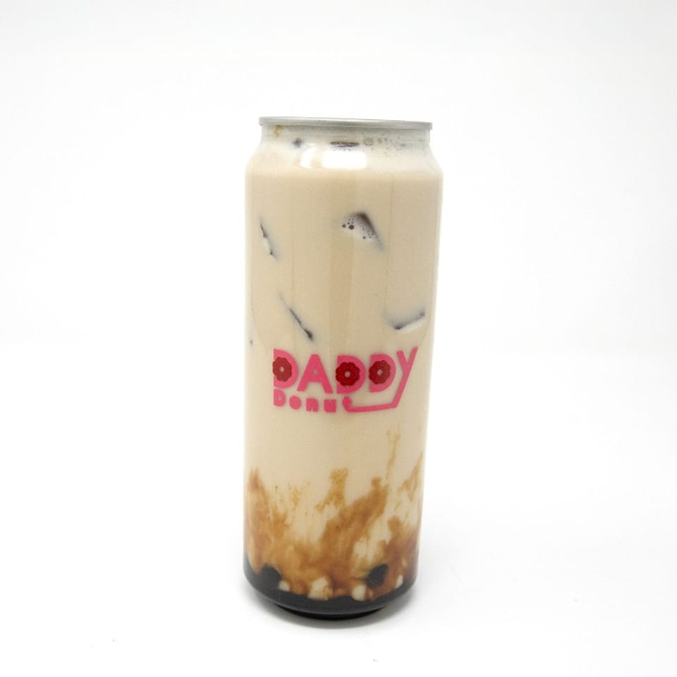 A Daddy Donut branded can of iced coffee with brown sugar swirls and boba pearls.