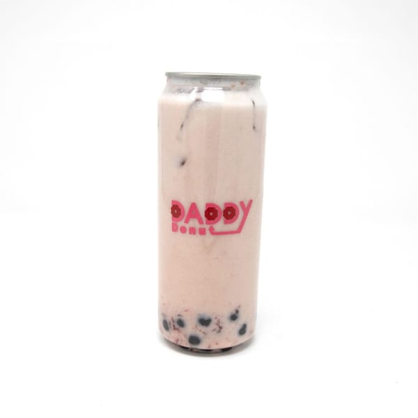 Daddy Donut's pink boba drink in a clear can with the brand logo.